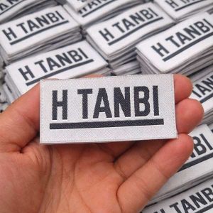 Custom size woven label with logo and care instructions